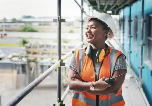 A happy, smiling and cheerful young woman - construction 
