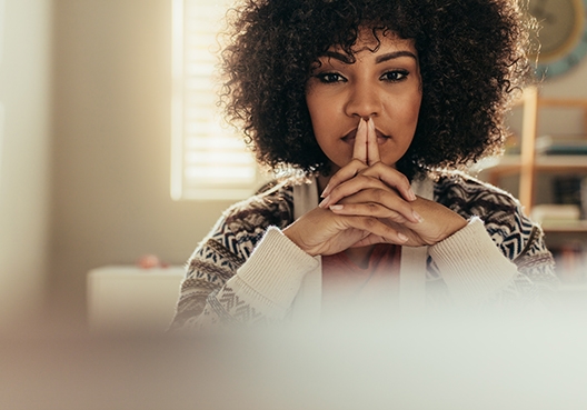 woman sitting in thought