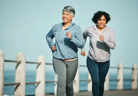 senior women at beach for health