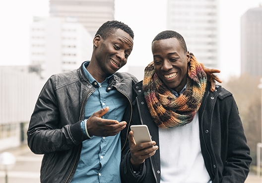 two people walking down the street