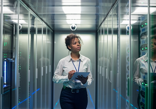 young woman standing in a server room