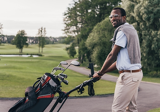 golfer walking with his carry bag