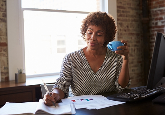 women working at her desk