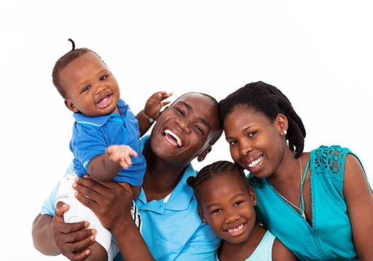 Family photo including parents and two kids